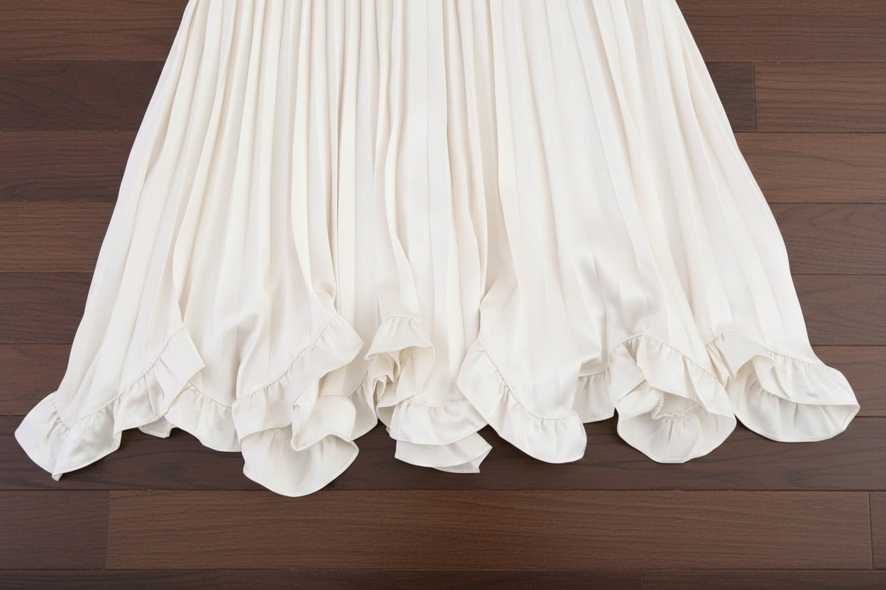 A‑line midi skirt with sculptural pleating