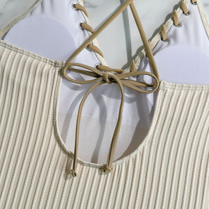Backless cutout swimsuit with rope‑tie straps