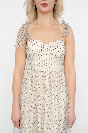 Sleeveless polka‑dot dress with ruched tube‑top bodice