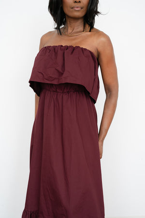 Solid‑color strapless maxi dress with soft ruching