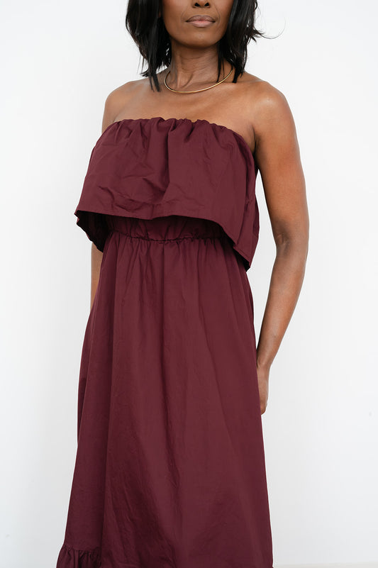 Solid‑color strapless maxi dress with soft ruching