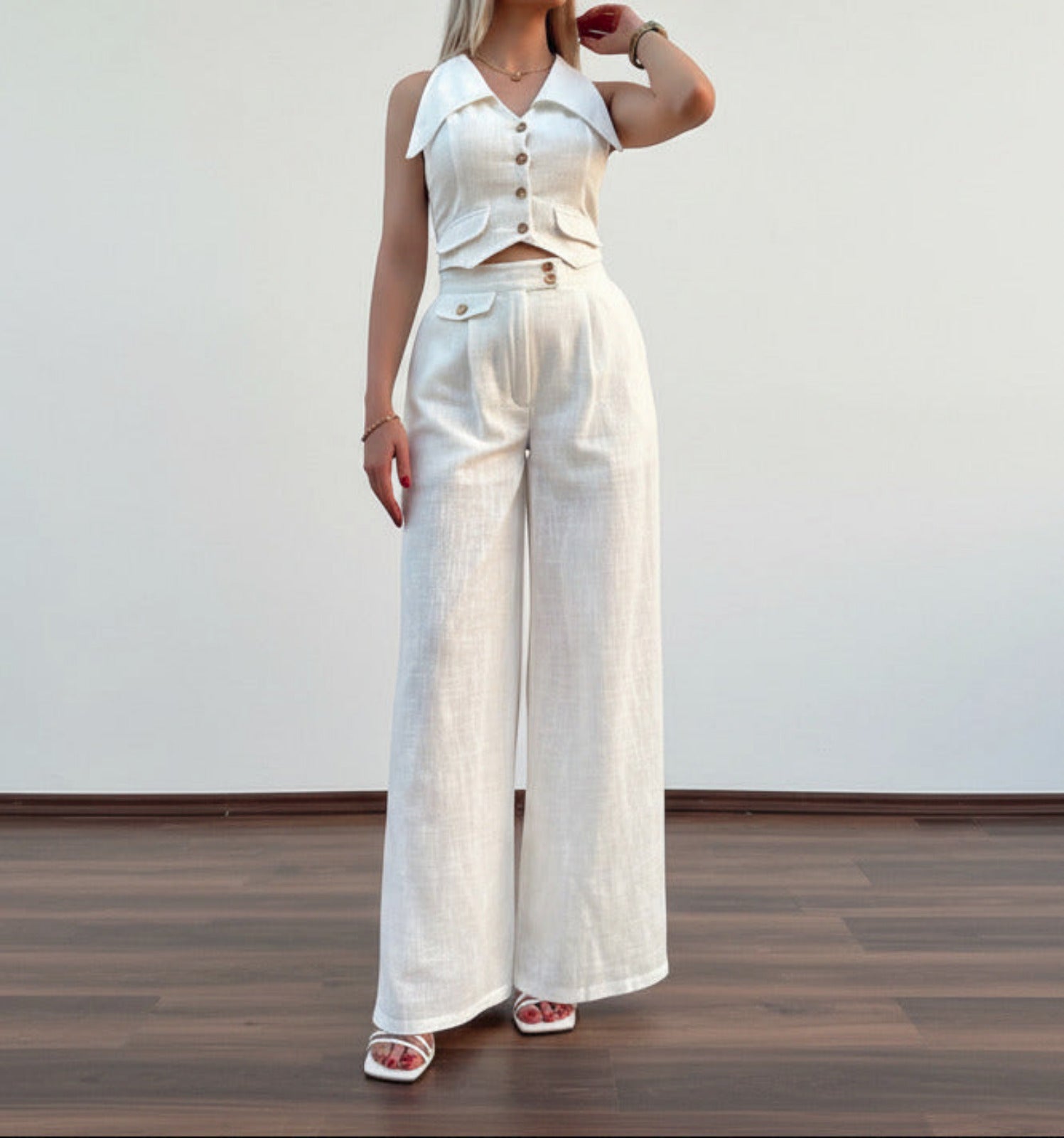 white Women’s summer two‑piece suit with collared vest and high‑rise trousers